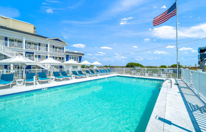The outdoor pool with American flag at our Cape May resort