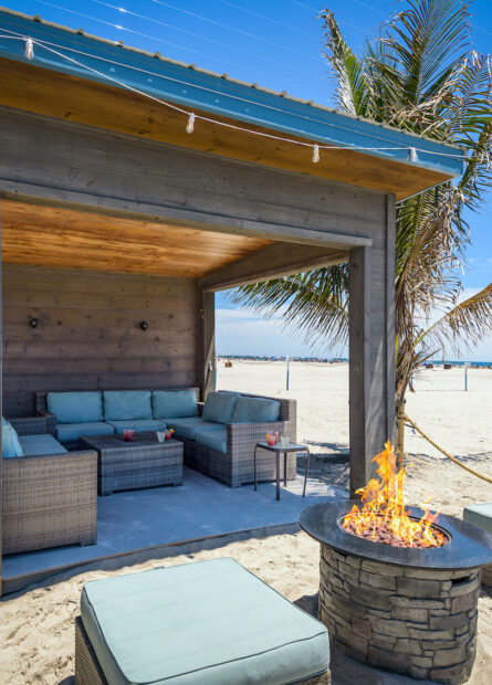 Outdoor Cabana with fire pit and seating at our Wildwood Crest hotel