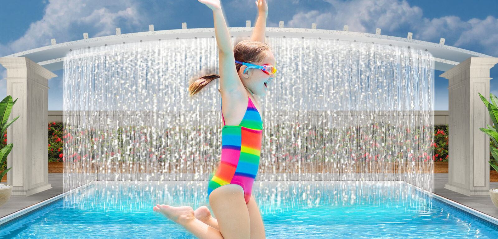 Young girl in a rainbow bathing suit jumping into our Diamond Beach resort pool