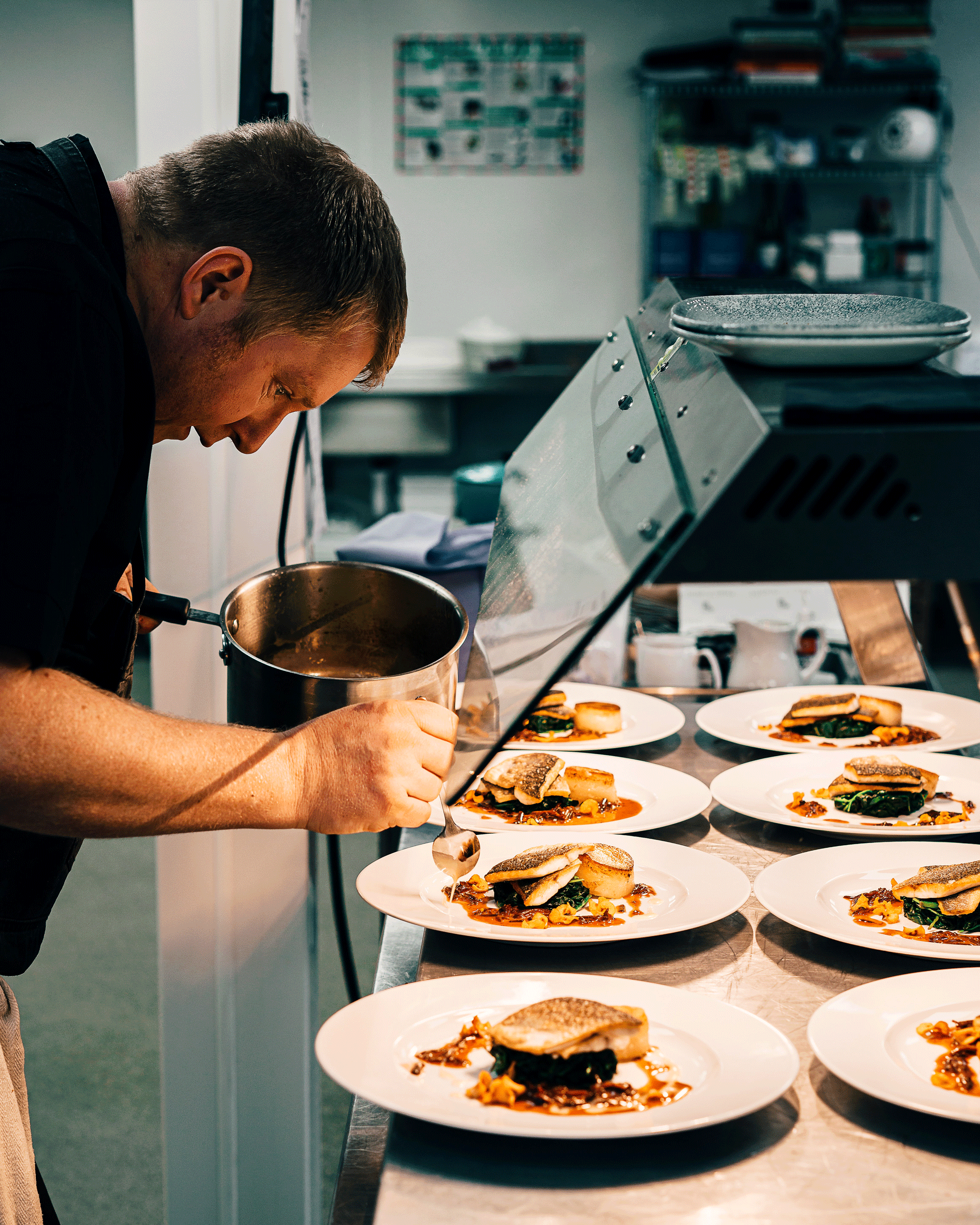 Chef preparing plates of food