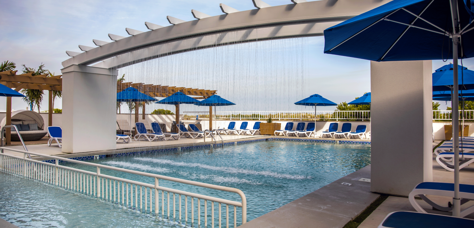 The swimming pool with overhead shower waterfall at our Wildwood Crest hotel