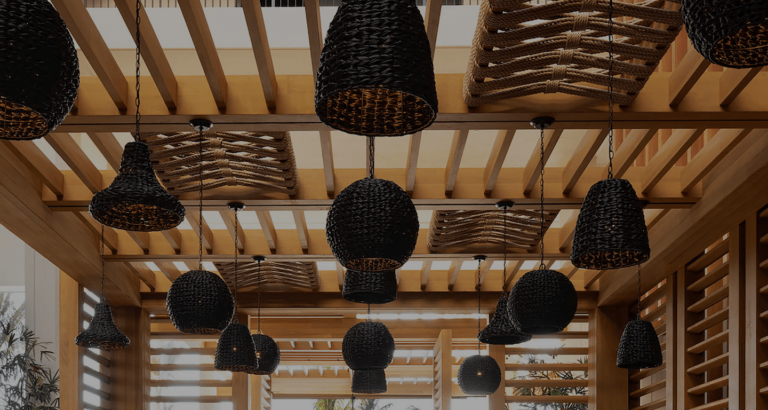 Wicker lights in a wooden-beam ceiling