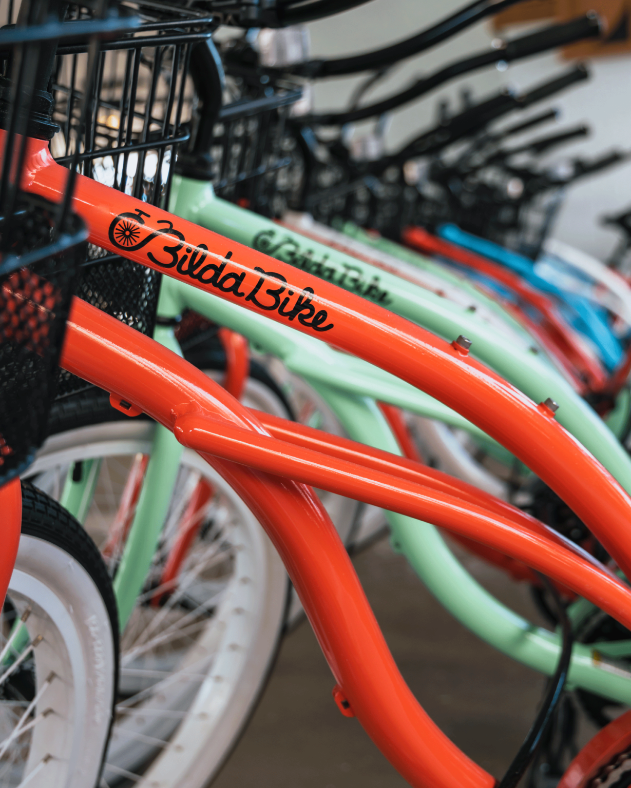 Close up photo of a colorful lineup of bicycles at our Wildwood Crest beach resort