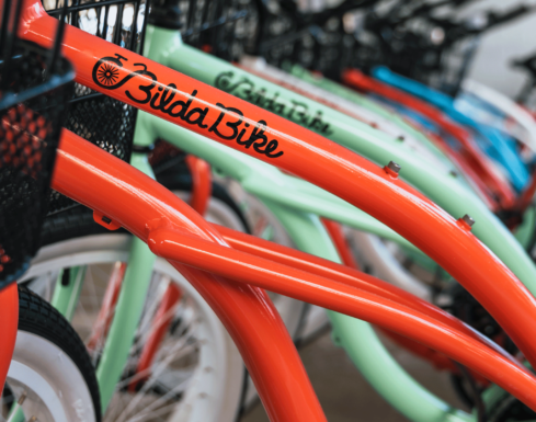Close up photo of a colorful lineup of bicycles