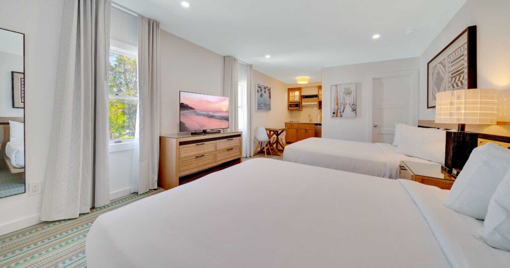Classic or Signature Queen Studio with 2 fluffy white beds at Cape May's Newest Hotel Mahalo