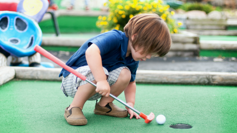 Child playing mini golf in Cape May