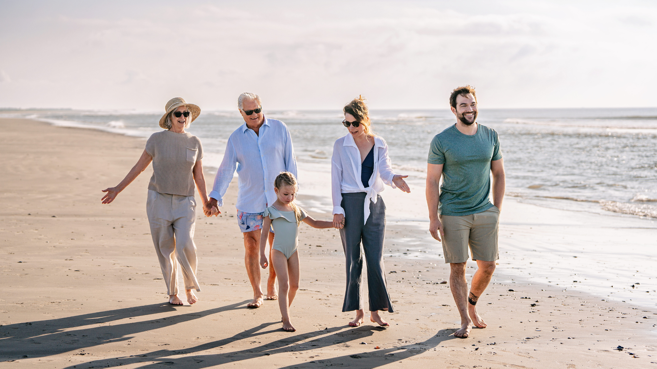 Family walking on the beach