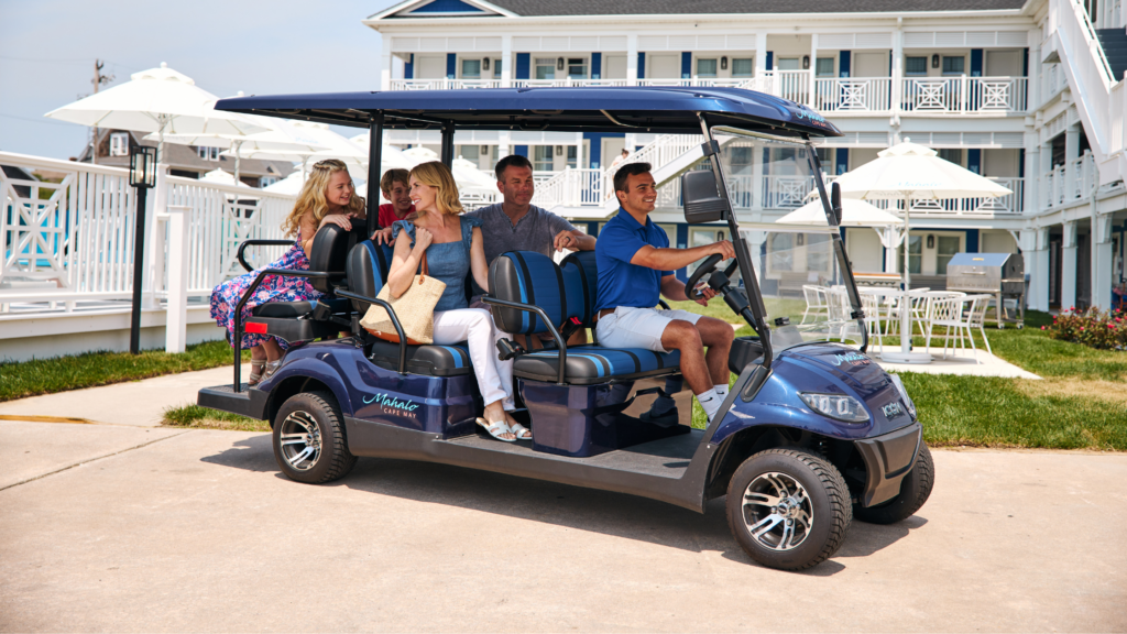 Family being driven on Mahalo Cape May golf cart