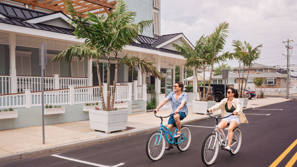 Man and woman riding Mahalo bicycles