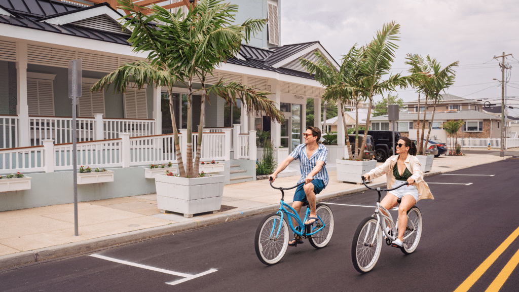 Couple riding bikes outside Mahalo Diamond Beach