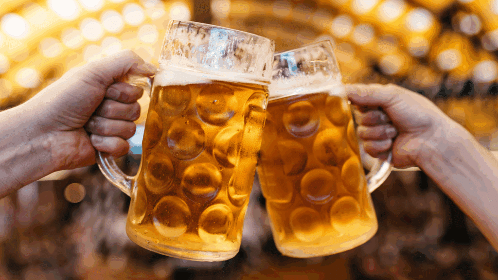 Closeup of two beers toasting