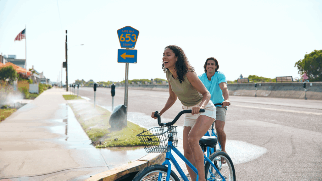 Couple riding bicycles on Beach Ave in Cape May, NJ