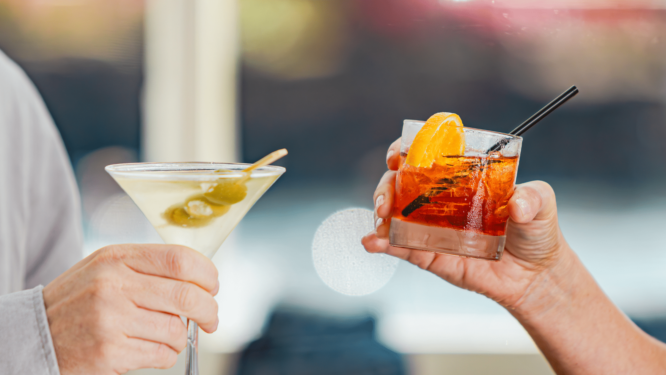 Two cocktails being held up for a toast in Cape May